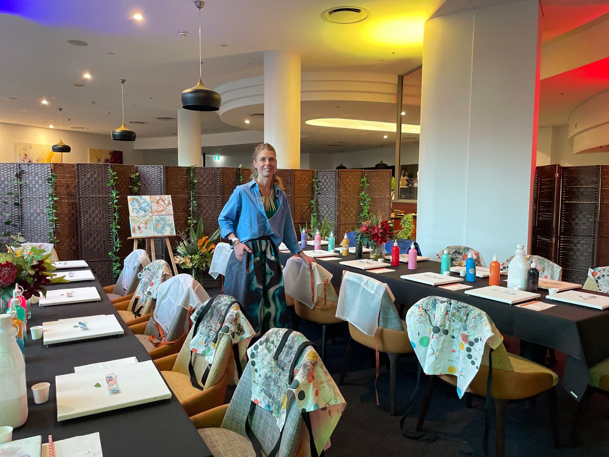 Lucia standing in the fully set workshop room at Crowne Plaza Sydney Airport